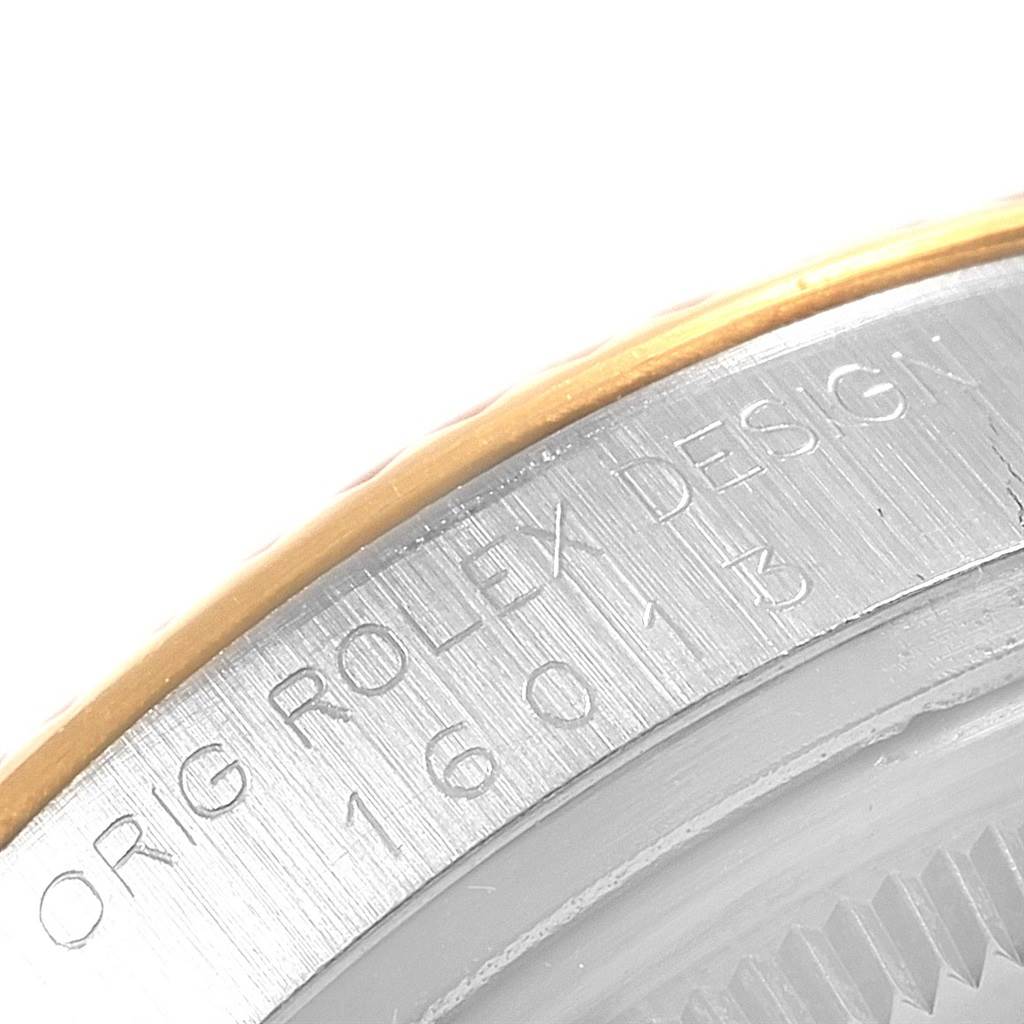 The image shows a close-up of the engraved case back of a Vintage Collection model by Rolex.