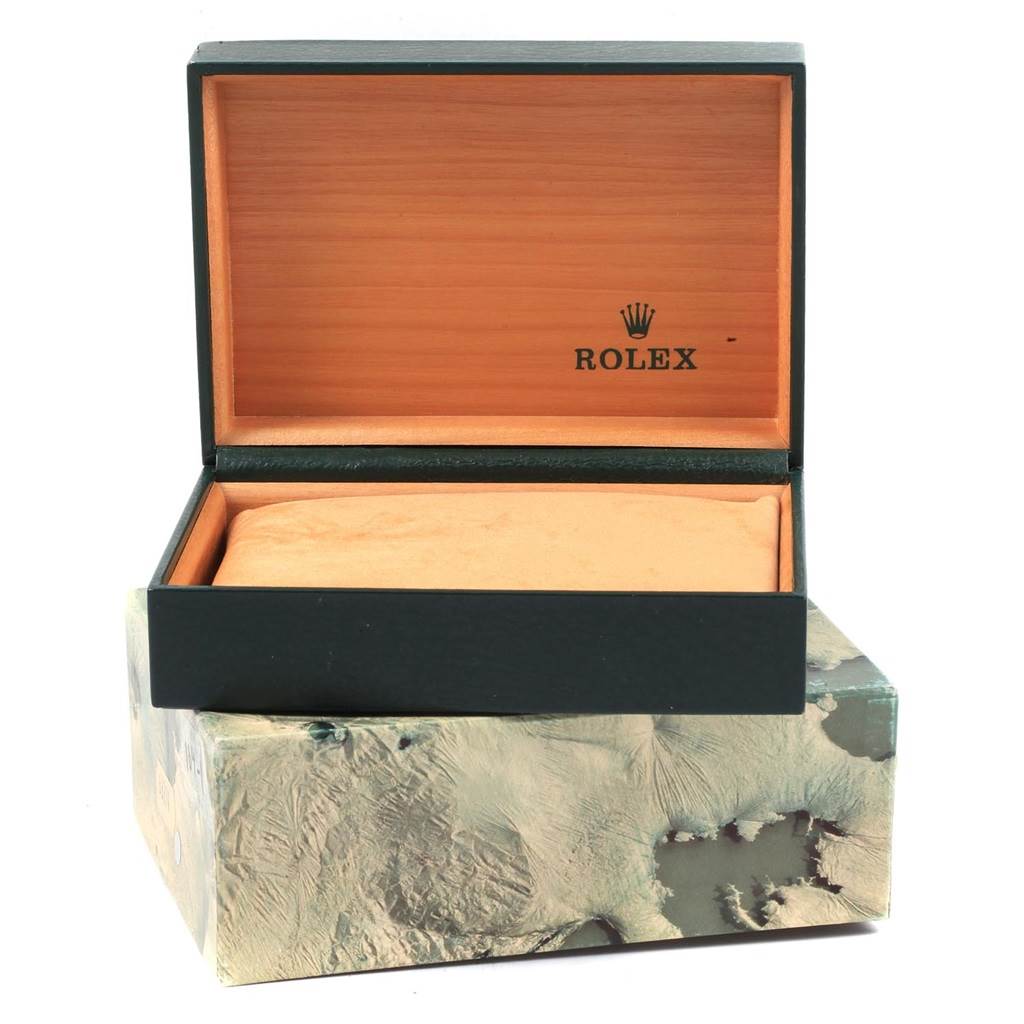 This image shows an open Rolex Vintage Collection 16013 Men's Stainless Steel Champagne Dial 16013 Men's Stainless Steel Champagne Dial watch box with a beige interior and the Rolex logo inside the lid.