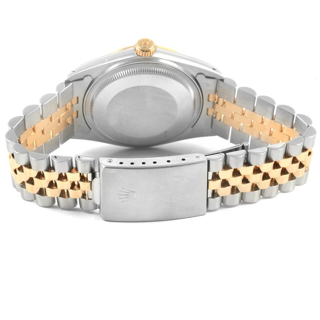 The image shows the back view of a Rolex Vintage Collection 16013 Men's Stainless Steel Champagne Dial 16013 Men's Stainless Steel Champagne Dial watch, highlighting the bracelet and clasp.