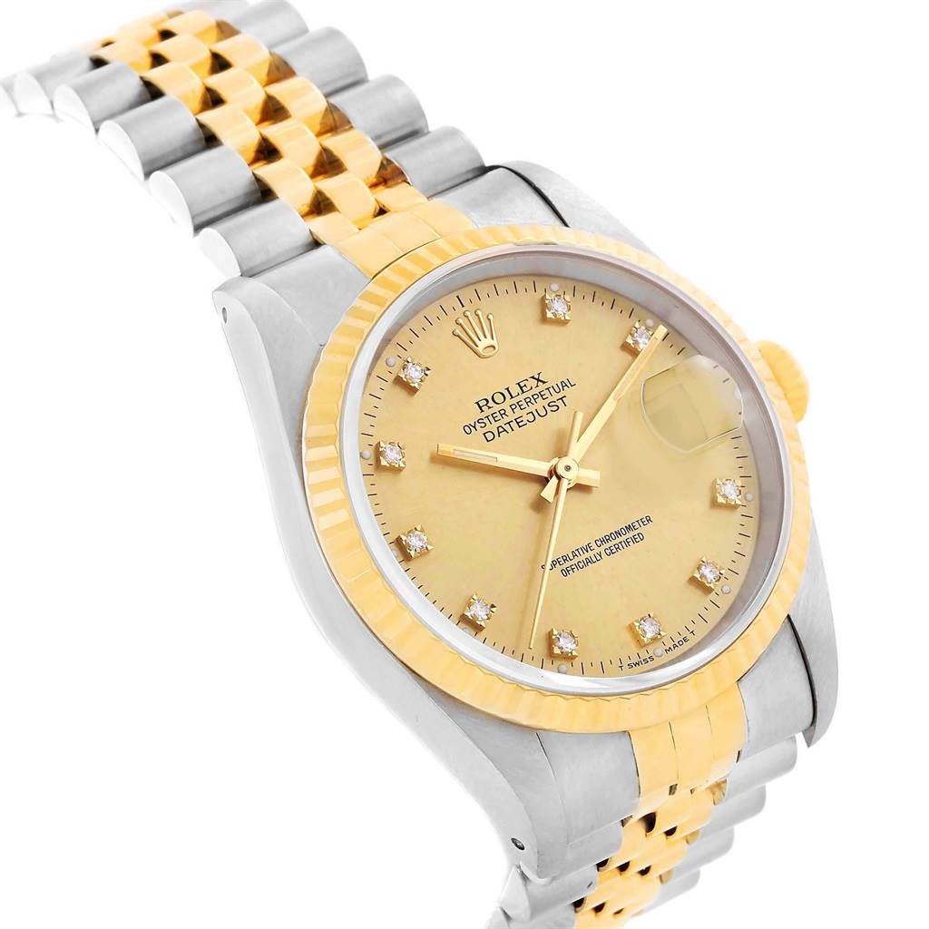 The image shows a close-up angled view of the face, bezel, and part of the bracelet of a Rolex Vintage Collection 16013 Men's Stainless Steel Champagne Dial 16013 Men's Stainless Steel Champagne Dial Oyster Perpetual Datejust watch.