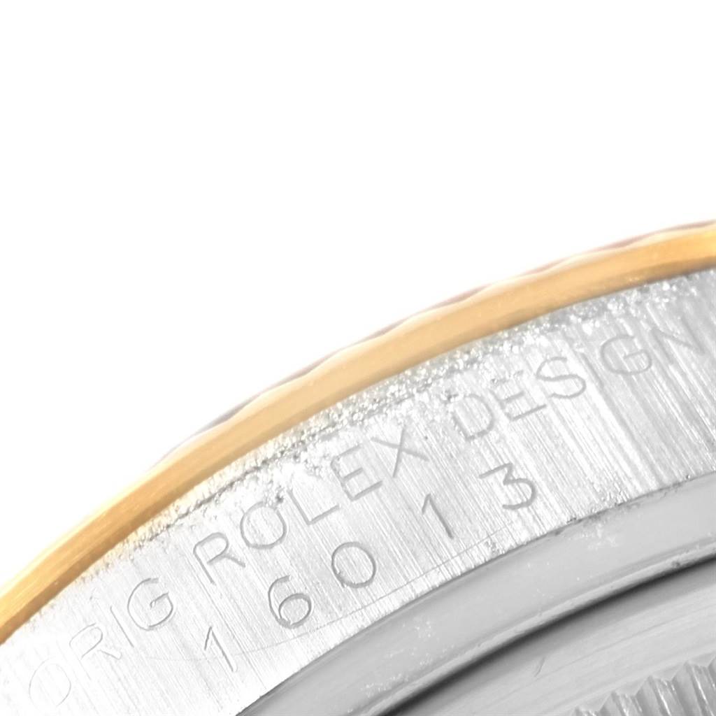 This close-up image shows the side of a Rolex Vintage Collection 16013 Men's Stainless Steel Champagne Dial 16013 Men's Stainless Steel Champagne Dial model 16013 watch, highlighting the engraved outer rim and part of the bezel.