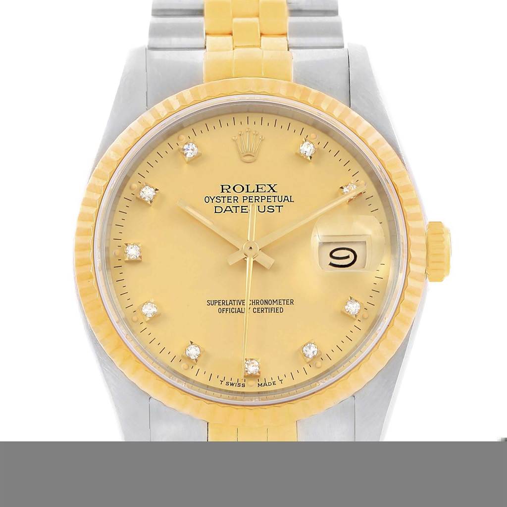 This image shows a frontal view of a Rolex Vintage Collection 16013 Men's Stainless Steel Champagne Dial 16013 Men's Stainless Steel Champagne Dial Oyster Perpetual Datejust watch, highlighting the face, bezel, and part of the bracelet.