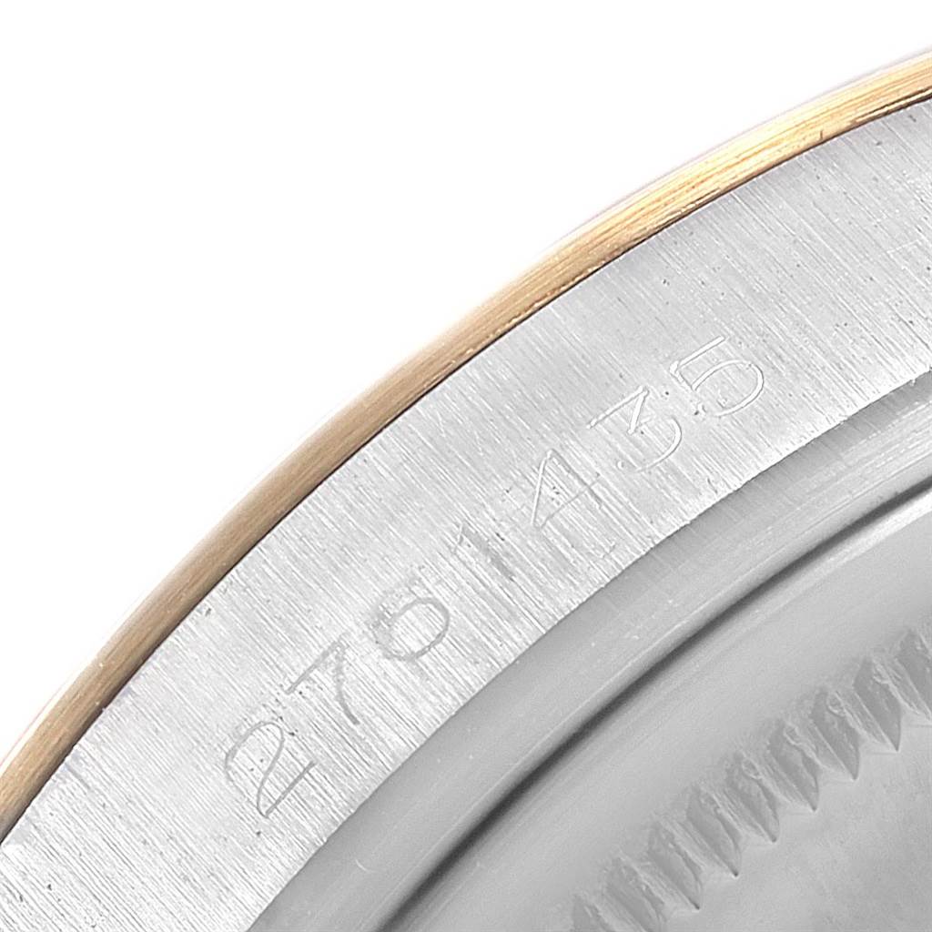 This close-up shows the serial number engraving on the outer edge of the Rolex Vintage Collection 1601 Men
s Steel and Gold (two tone) Grey Dial 1601 Men
s Steel and Gold (two tone) Grey Dial watch case.