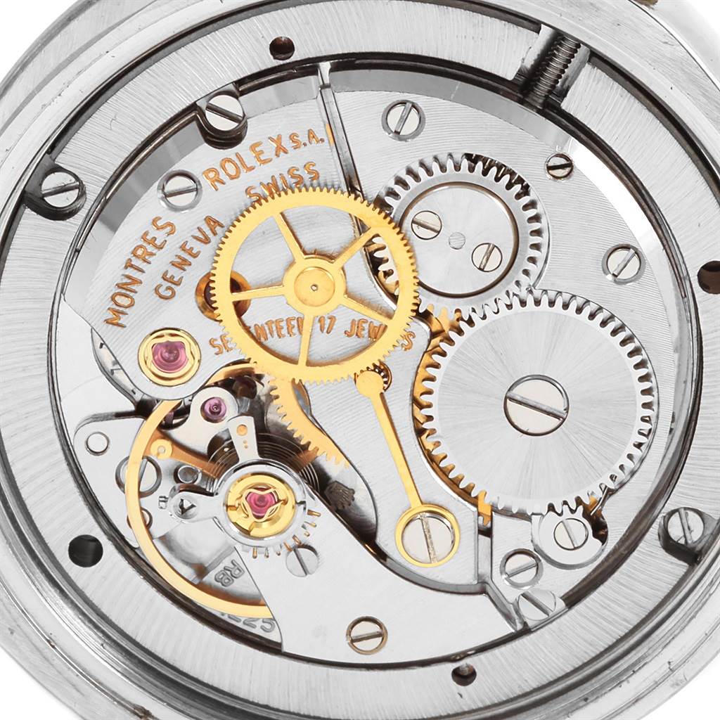 The image shows the internal mechanical movement of a Rolex Vintage Collection 6694 Men
s Stainless Steel Silver Dial 6694 Men
s Stainless Steel Silver Dial watch from a close-up top view, showcasing gears and components.