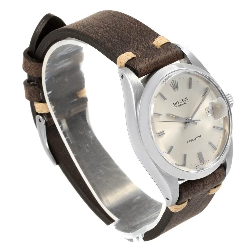 The Vintage Collection Rolex watch is shown at an angled view displaying its face, bezel, case, and brown leather strap.