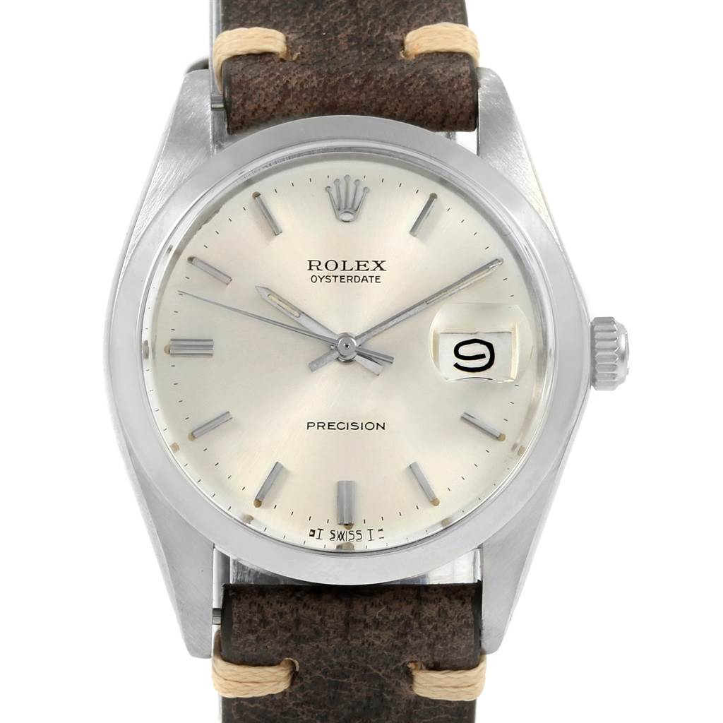This image shows a frontal view of the Vintage Collection Rolex watch, including the face, hands, date window, and part of the strap.