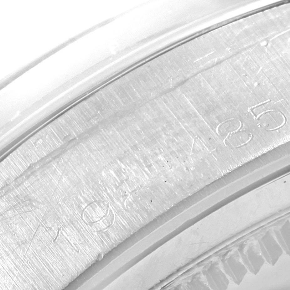 This close-up image shows the case back and serial number engravings of the Vintage Collection model by Rolex.