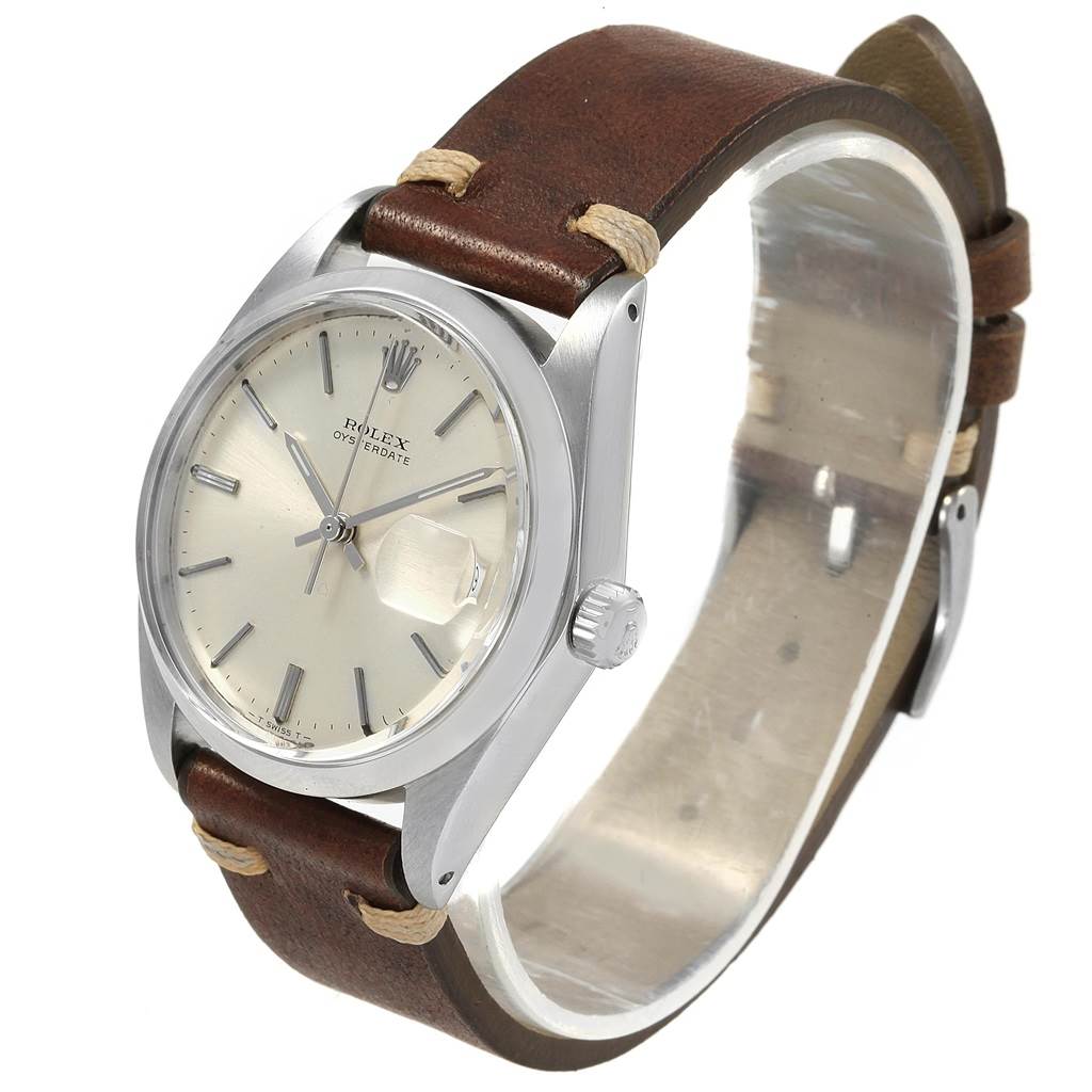 The Rolex Vintage Collection 6694 Men
s Stainless Steel Silver Dial 6694 Men
s Stainless Steel Silver Dial watch is shown at an angle highlighting the dial, case, crown, and brown leather strap.