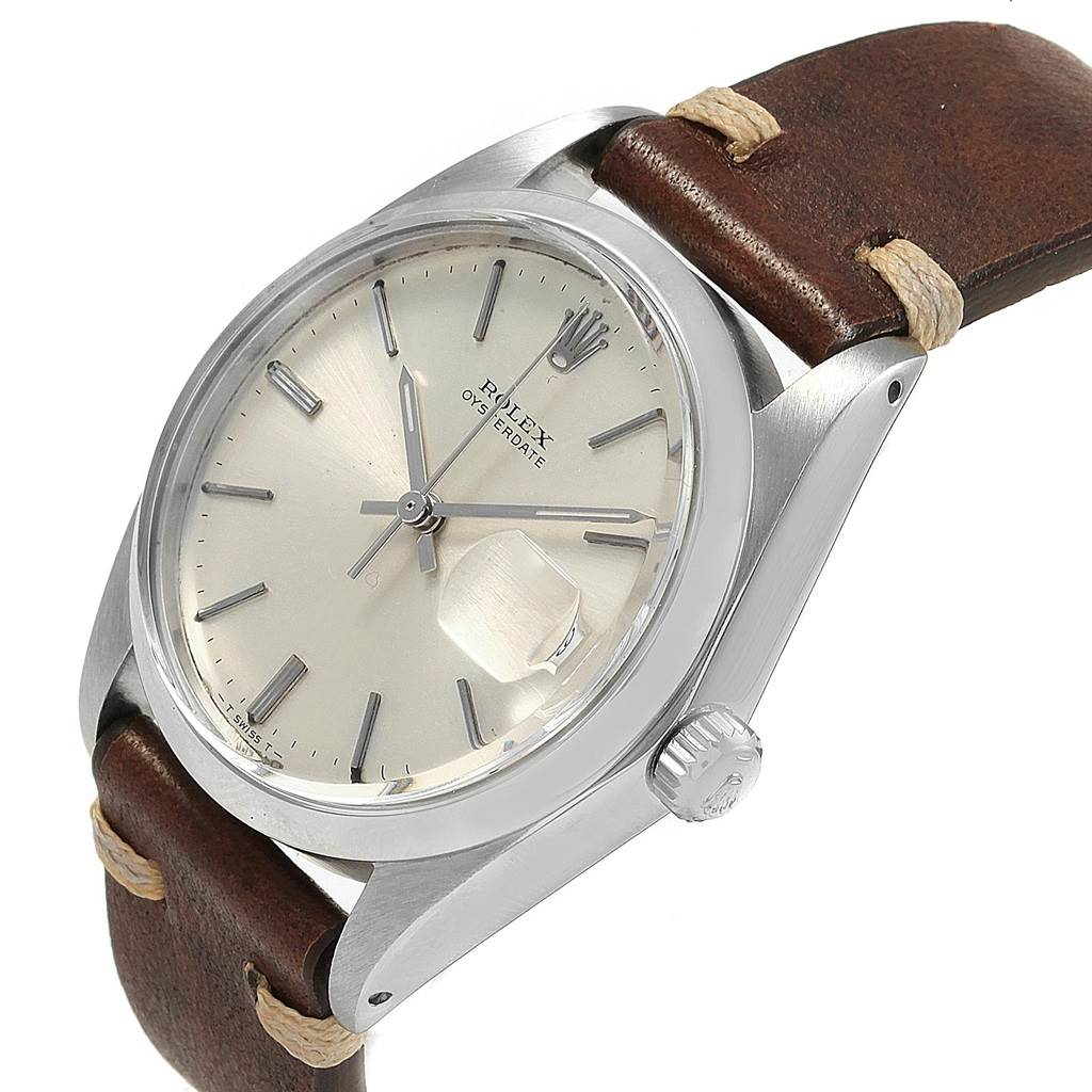 The Rolex Vintage Collection 6694 Men
s Stainless Steel Silver Dial 6694 Men
s Stainless Steel Silver Dial watch is shown at an angled view highlighting the dial, bezel, crown, and leather strap.