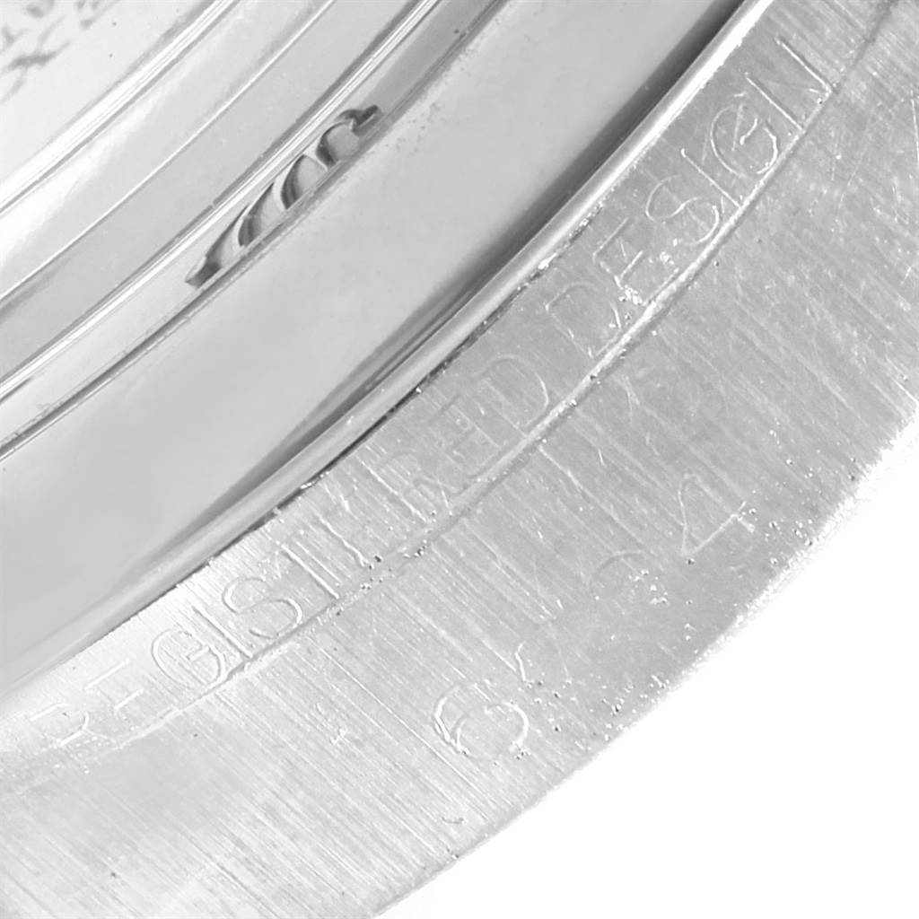 The image shows a close-up angle of the engraved bezel of a Vintage Collection model by Rolex.