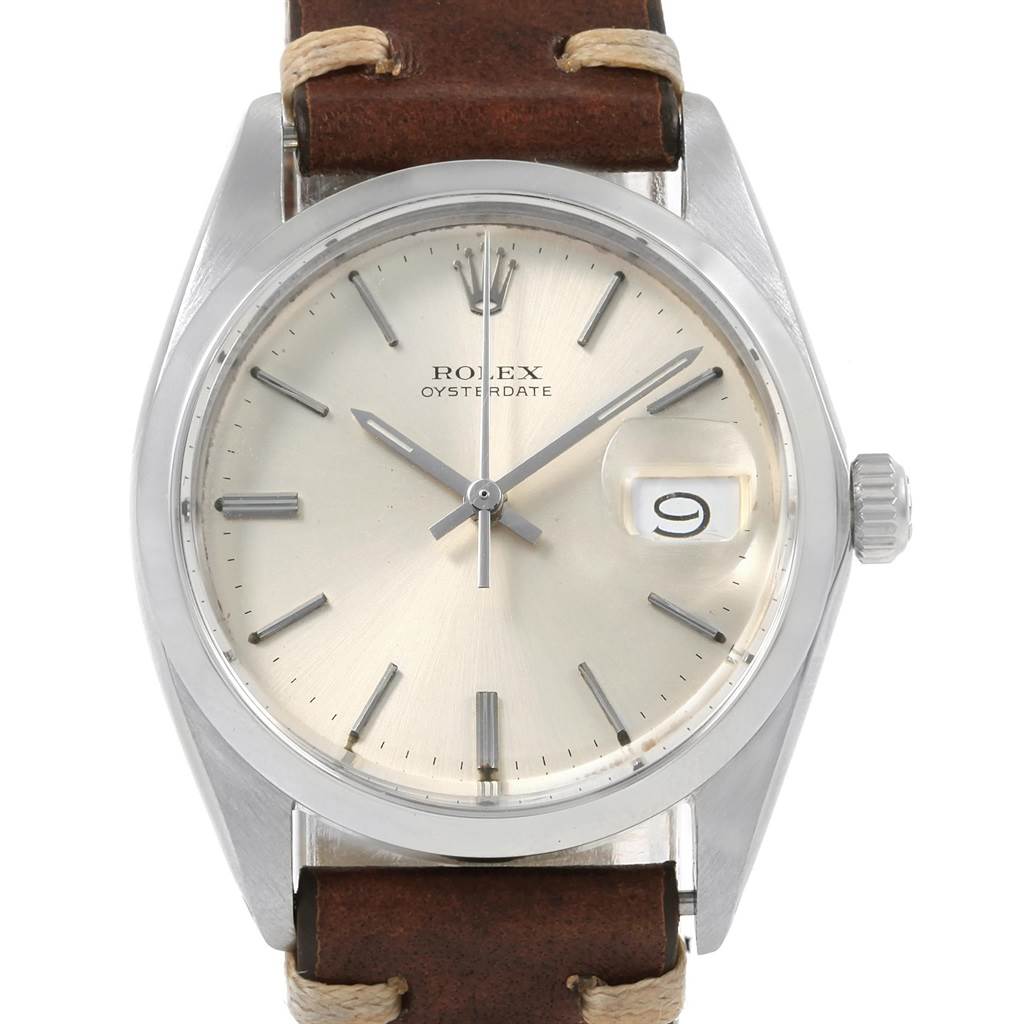 The image shows a front view of the Rolex Vintage Collection 6694 Men
s Stainless Steel Silver Dial 6694 Men
s Stainless Steel Silver Dial Oysterdate watch, displaying its face, crown, and leather strap.