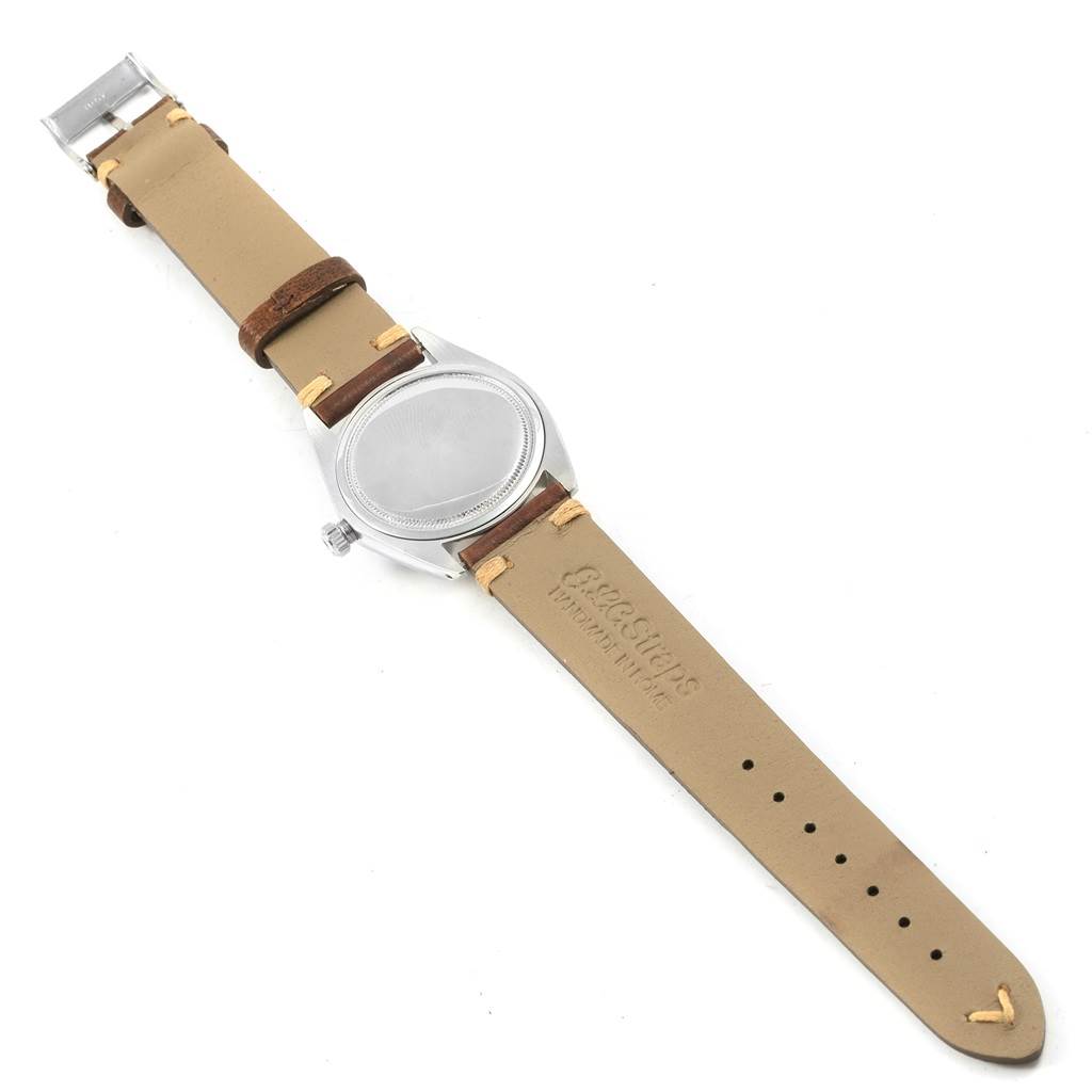 This image shows the back view of the Vintage Collection model by Rolex, highlighting the watch
s case and leather strap.