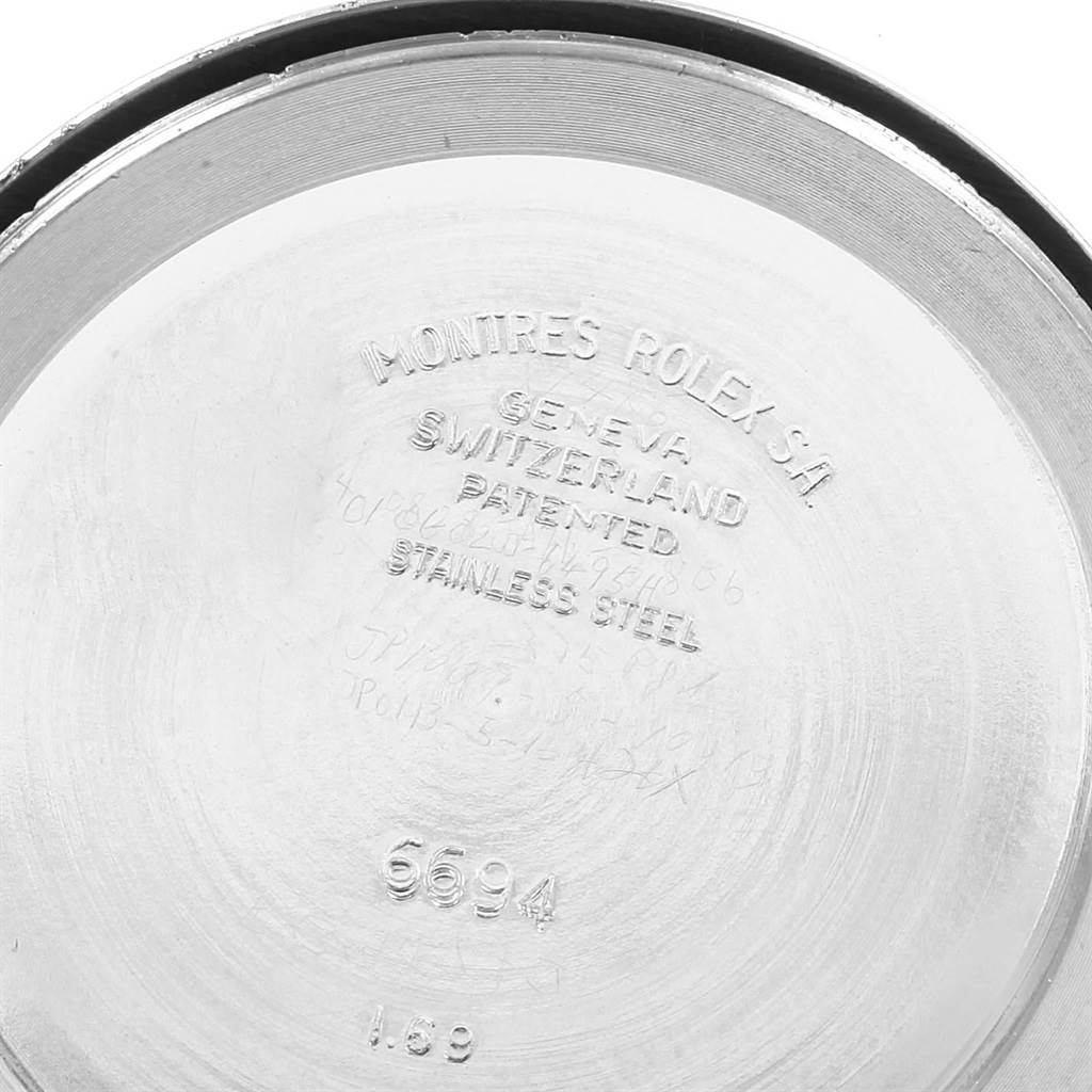 This image shows the inner case back of a Rolex Vintage Collection 6694 Men
s Stainless Steel Silver Dial 6694 Men
s Stainless Steel Silver Dial model, displaying markings like "Montres Rolex S.A." and the model number "6694".