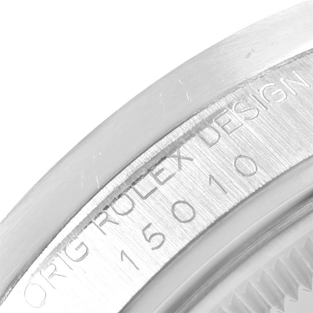 This close-up image shows the engraved model number "15010" and "ROLEX DESIGN" on the edge of a Vintage Collection Rolex watch.