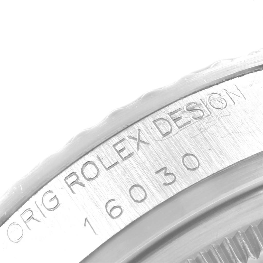 The image shows a close-up angle of the engraved text and model number on the side of a Rolex Vintage Collection 16030 Men's Stainless Steel Brown Dial 16030 Men's Stainless Steel Brown Dial watch, model 16030.