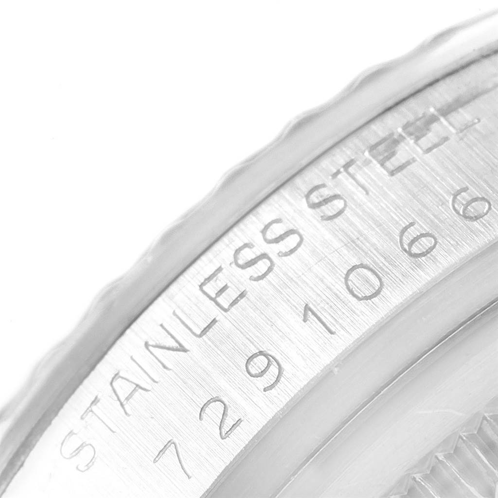 The image shows a close-up of the stainless steel case edge with engraved details from a Rolex Vintage Collection 16030 Men's Stainless Steel Brown Dial 16030 Men's Stainless Steel Brown Dial model watch.