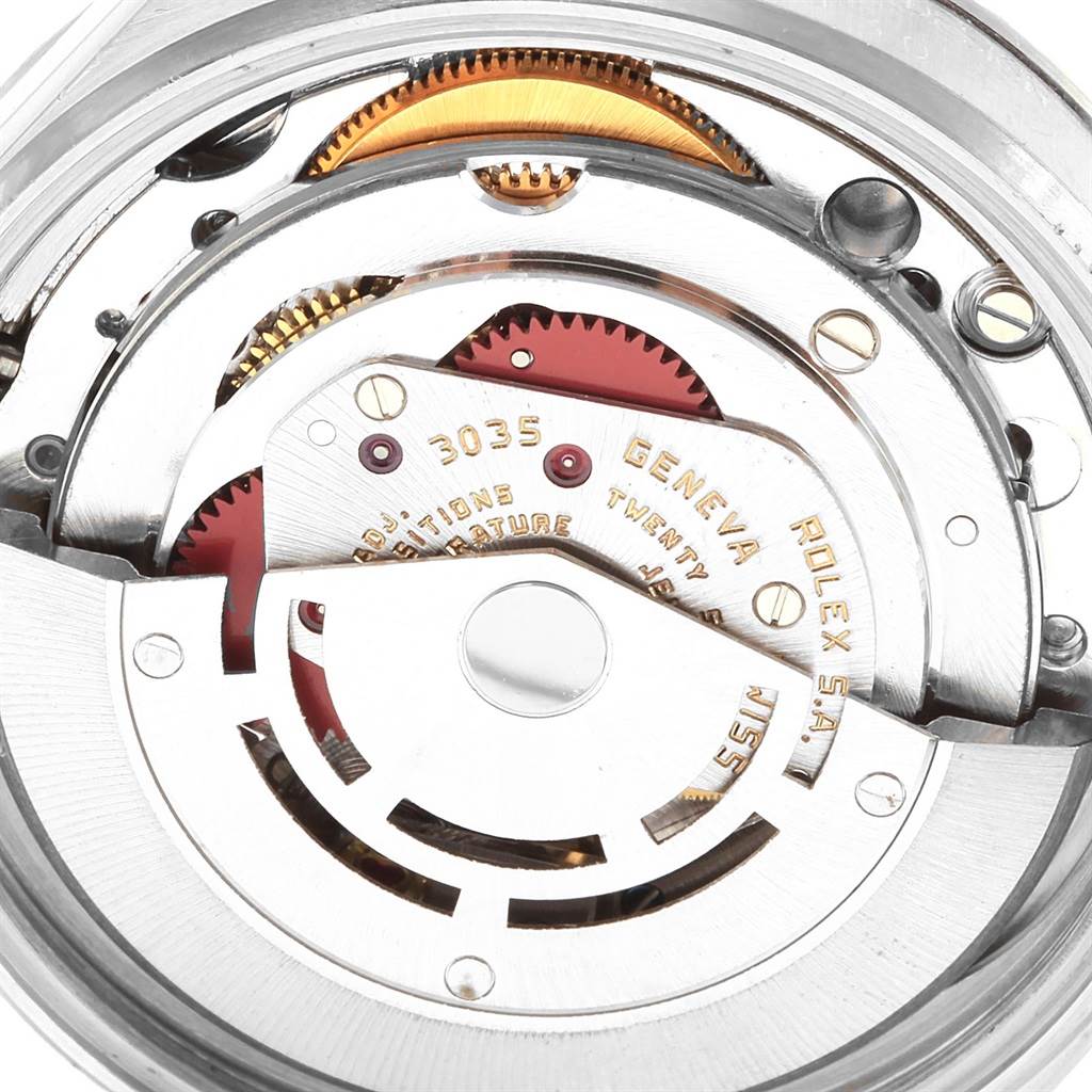 Close-up of the inner mechanism of a Rolex Vintage Collection 16030 Men's Stainless Steel Brown Dial 16030 Men's Stainless Steel Brown Dial watch, showcasing gears and intricate parts.