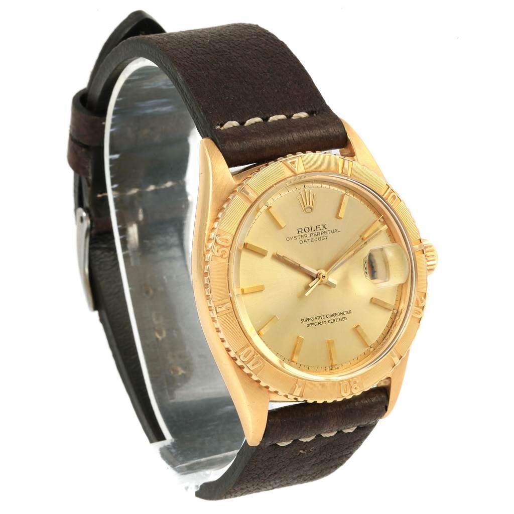 The image shows a Rolex Vintage Collection 1625 Men's Yellow Gold Champagne Dial 1625 Men's Yellow Gold Champagne Dial Datejust watch at a three-quarter angle, highlighting the gold case, dial, and leather strap.