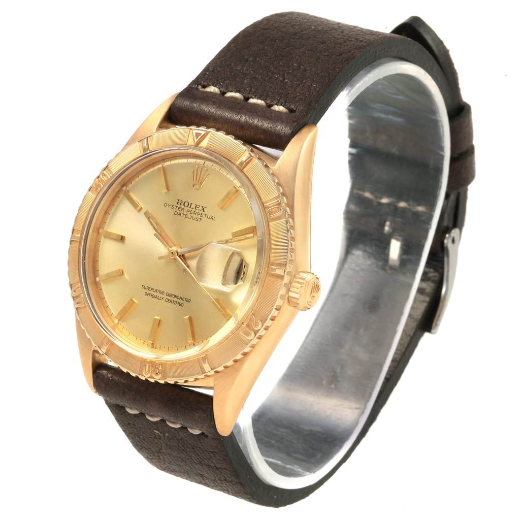 The Rolex Vintage Collection 1625 Men's Yellow Gold Champagne Dial 1625 Men's Yellow Gold Champagne Dial model watch is shown at a slight angle, displaying the face, bezel, crown, and leather strap.