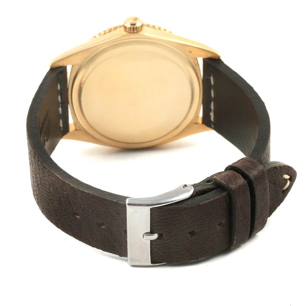 The image shows the backside and strap of a Rolex Vintage Collection 1625 Men's Yellow Gold Champagne Dial 1625 Men's Yellow Gold Champagne Dial watch, with a leather band and clasp visible.