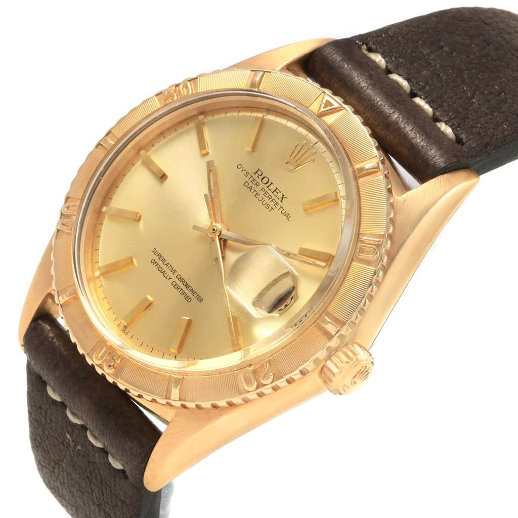 The Vintage Collection Rolex watch is shown at a slight angle from the front, displaying its dial, bezel, and part of the leather strap.