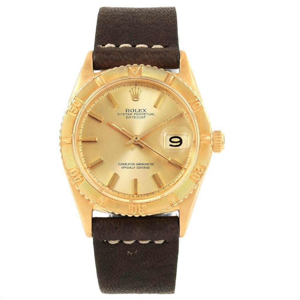 This image shows the front view of a Vintage Collection Rolex Oyster Perpetual Datejust watch with a gold dial and brown leather strap.