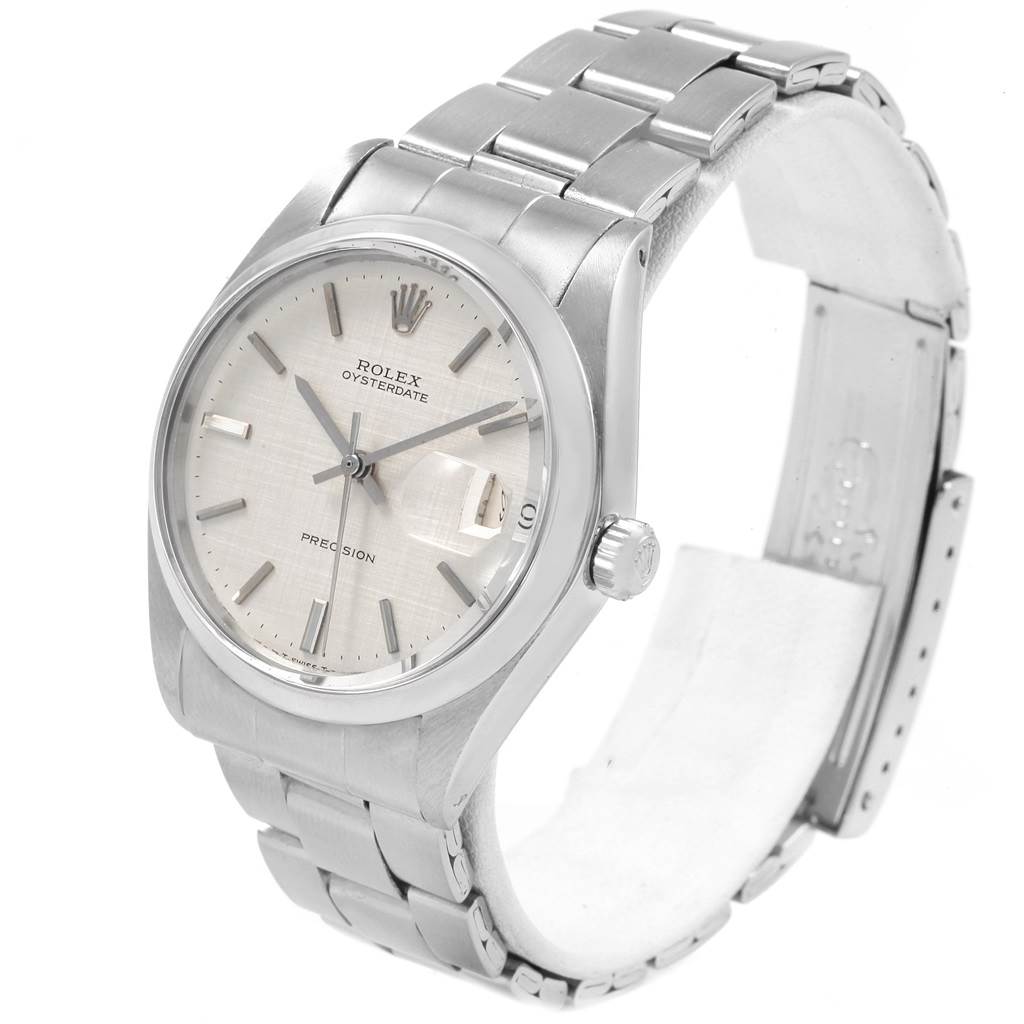 The image shows a Rolex Vintage Collection 6694 Men
s Stainless Steel Silver Dial 6694 Men
s Stainless Steel Silver Dial Oysterdate model from a left-front angle displaying the dial, crown, and part of the bracelet.