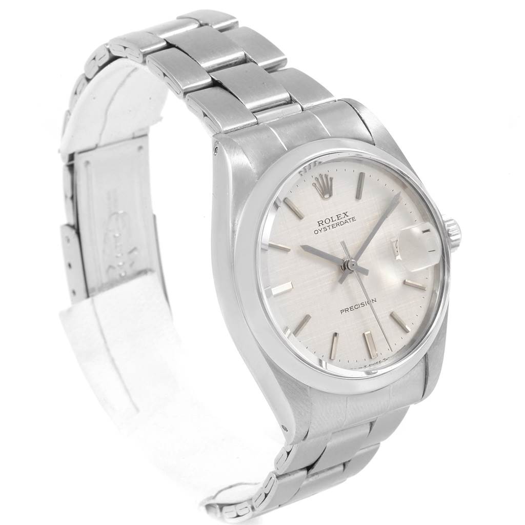 The image shows a Rolex Vintage Collection 6694 Men
s Stainless Steel Silver Dial 6694 Men
s Stainless Steel Silver Dial watch from a three-quarter angle, displaying its dial, case, bracelet, and clasp.