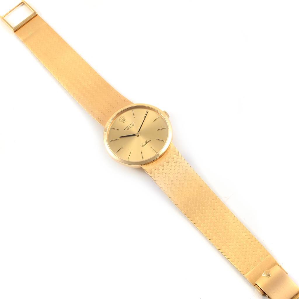 The image shows a gold Rolex Vintage Collection 4309 Men
s Yellow Gold Champagne Dial 4309 Men
s Yellow Gold Champagne Dial watch from a top-down angle, displaying its dial, bracelet, and clasp.