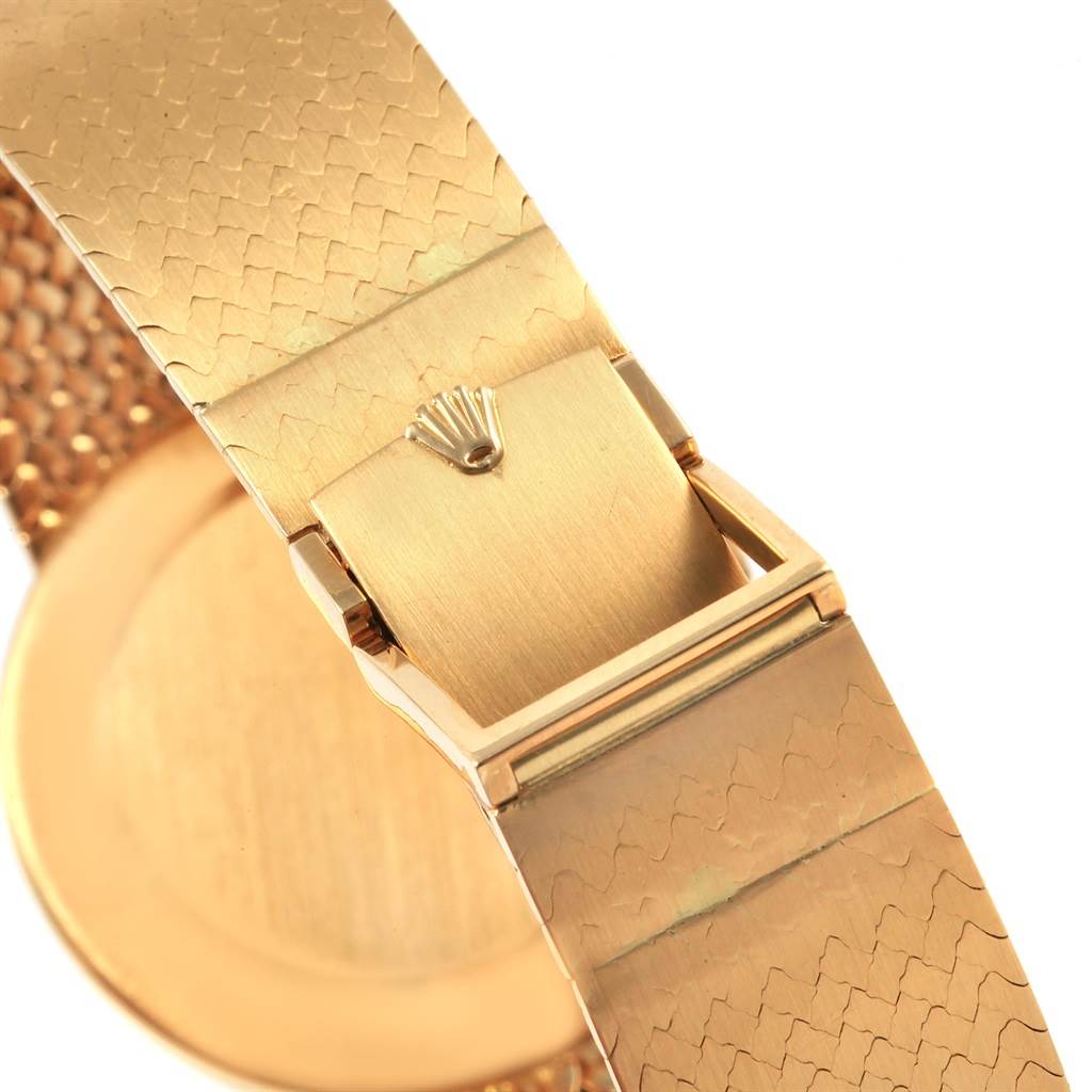 The image shows the clasp and bracelet of the Rolex Vintage Collection 4309 Men
s Yellow Gold Champagne Dial 4309 Men
s Yellow Gold Champagne Dial model, highlighting the Rolex logo on the clasp.