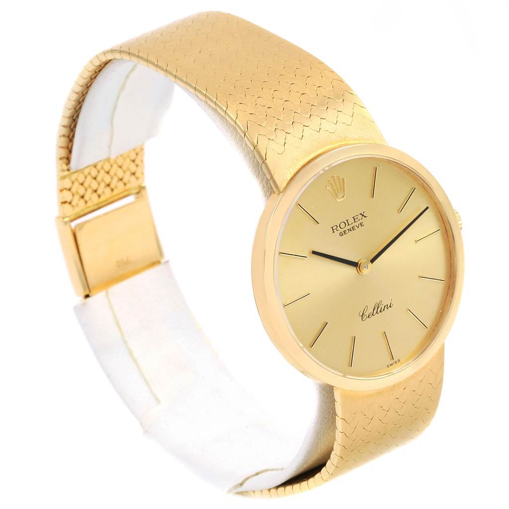 The Rolex Vintage Collection 4309 Men
s Yellow Gold Champagne Dial 4309 Men
s Yellow Gold Champagne Dial watch is shown from a side angle, displaying its gold dial, gold strap, and clasp.