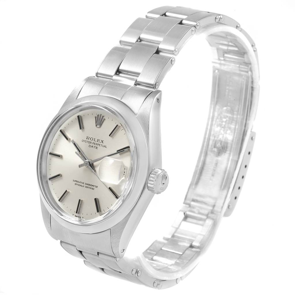 The image shows a side angle of the Rolex Vintage Collection 1500 Men
s Stainless Steel Silver Dial 1500 Men
s Stainless Steel Silver Dial watch, displaying the face, bezel, and partially unlatched metal band.