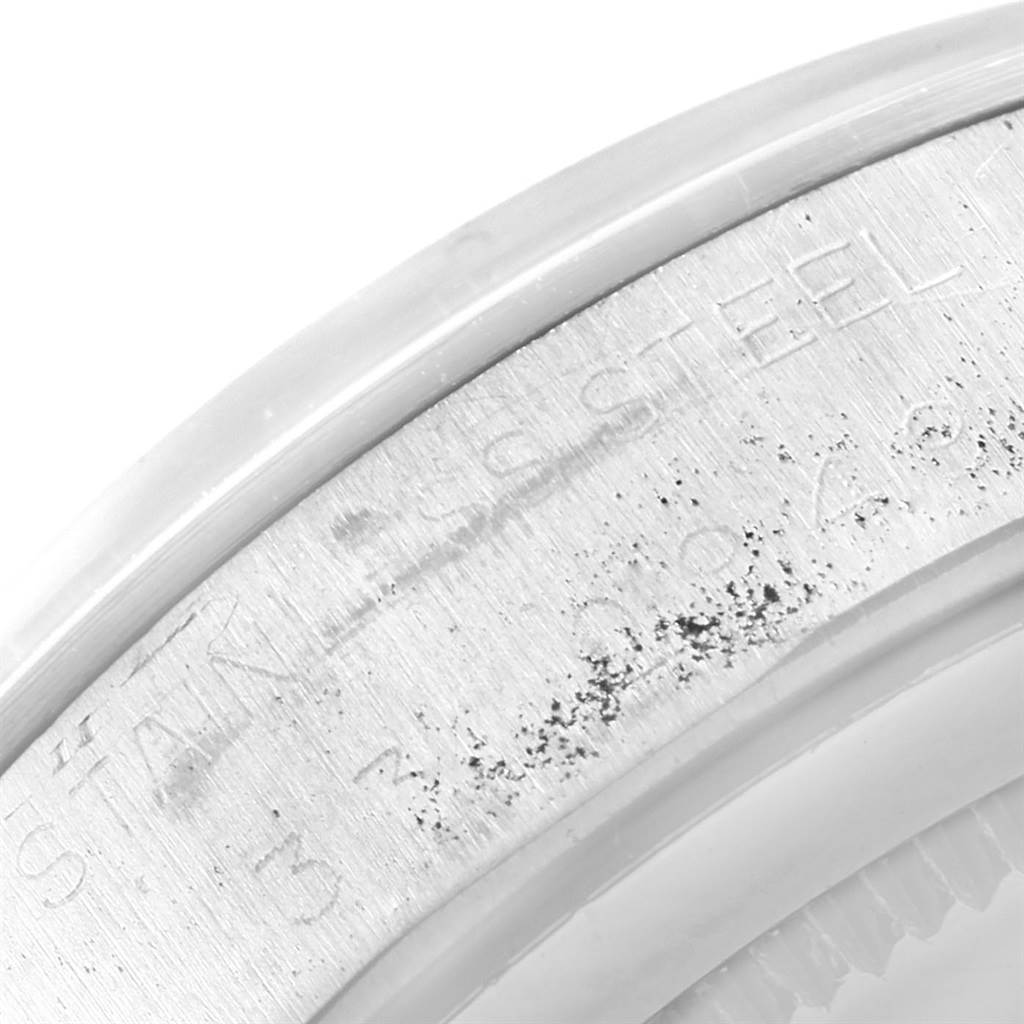 This close-up image shows part of the stainless steel back case of the Rolex Vintage Collection 6694 Men
s Stainless Steel Black Dial 6694 Men
s Stainless Steel Black Dial watch.