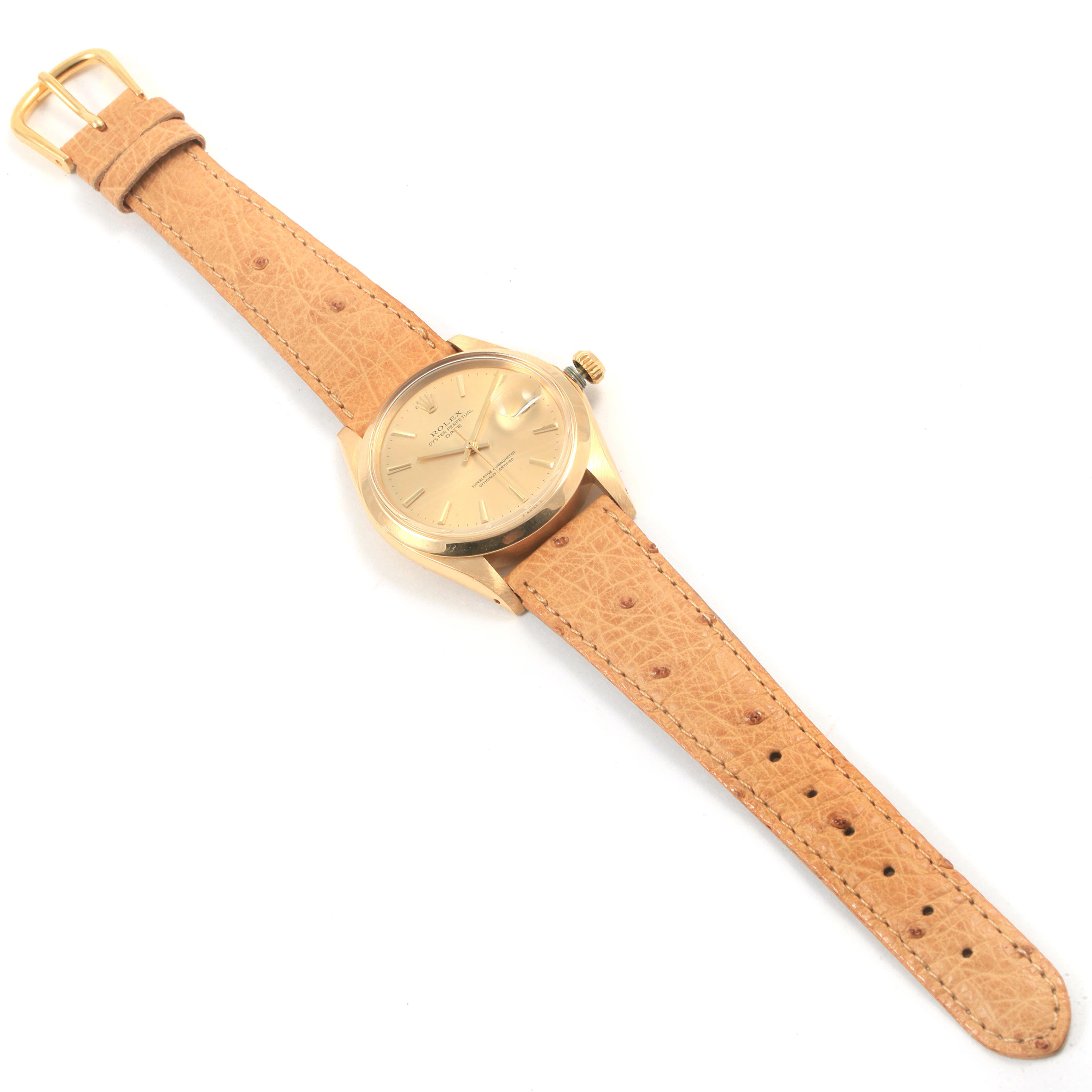 This Rolex Vintage Collection 1500 Men
s Yellow Gold Champagne Dial 1500 Men
s Yellow Gold Champagne Dial model watch is shown from a top-down angle, displaying the face, strap, and buckle.