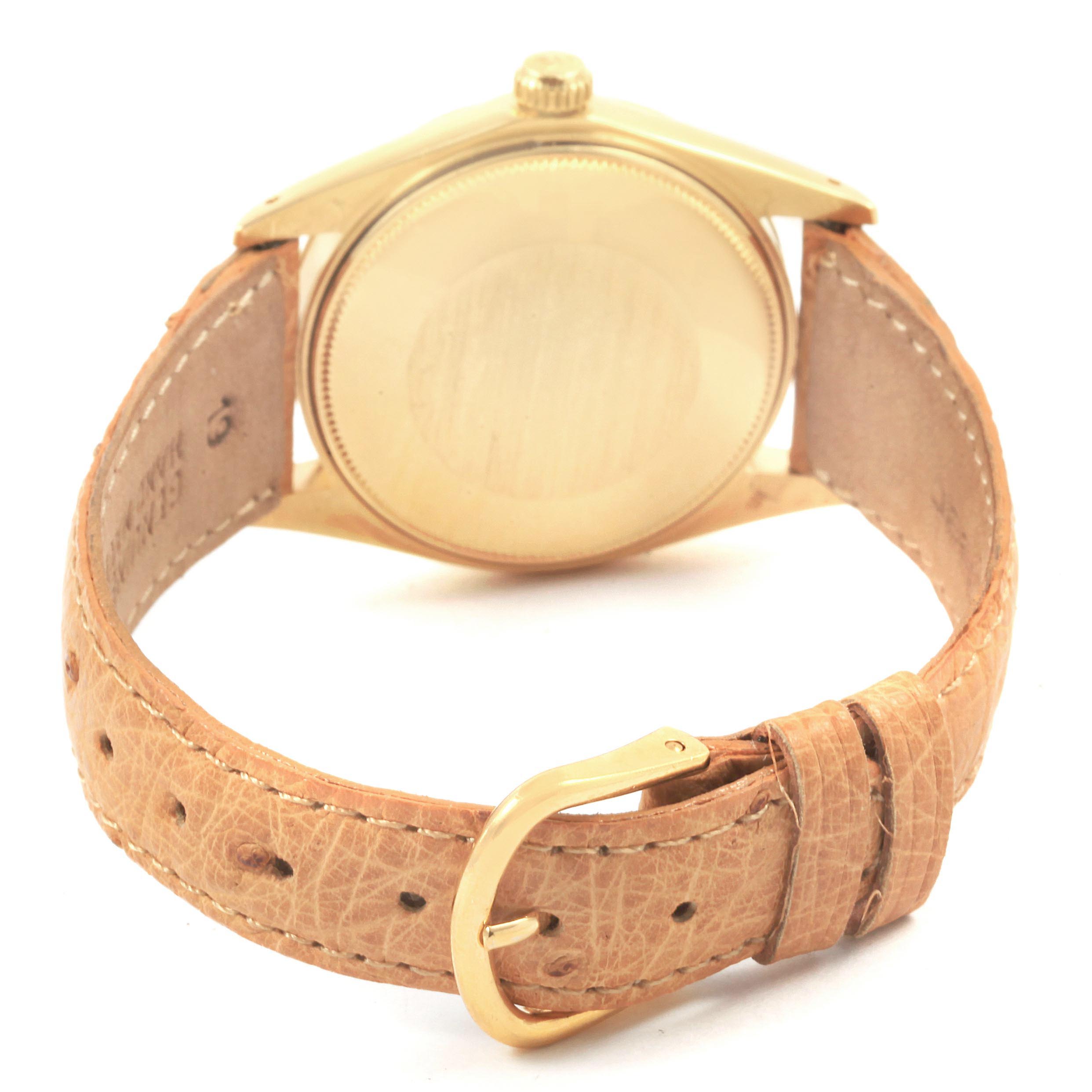 The image shows the back case and leather strap of a Rolex Vintage Collection 1500 Men
s Yellow Gold Champagne Dial 1500 Men
s Yellow Gold Champagne Dial watch from a rear angle.