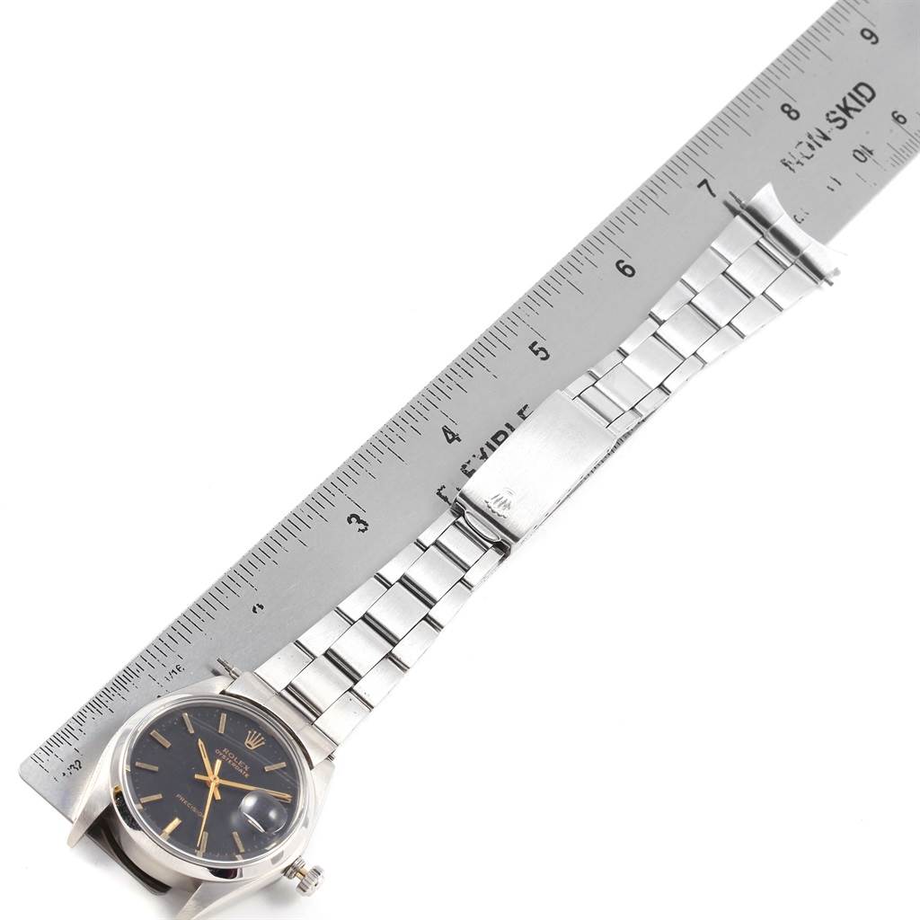 This image shows a Vintage Collection Rolex watch laid flat, with its face, case, and metal bracelet visible alongside a ruler for scale.