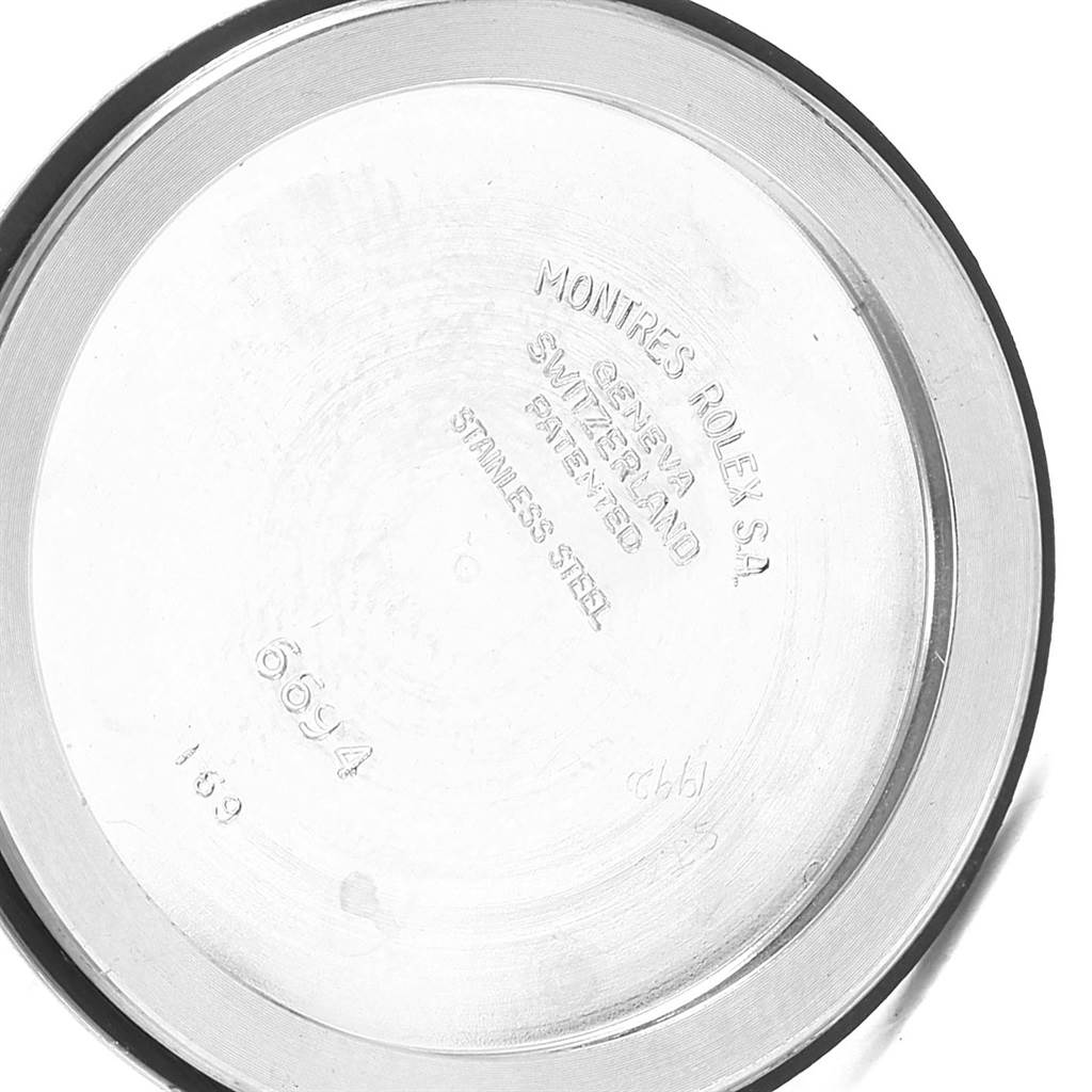 This image shows the inside of the case back of a Vintage Collection model by Rolex.