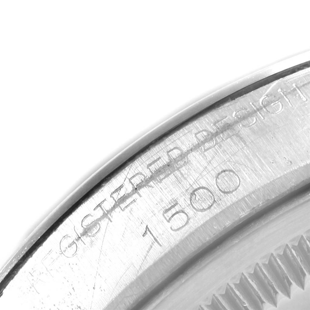 This image shows an up-close view of the case back of a Rolex Vintage Collection 1500 Men's Stainless Steel Silver Dial 1500 Men's Stainless Steel Silver Dial model, featuring engravings including the number "1500".