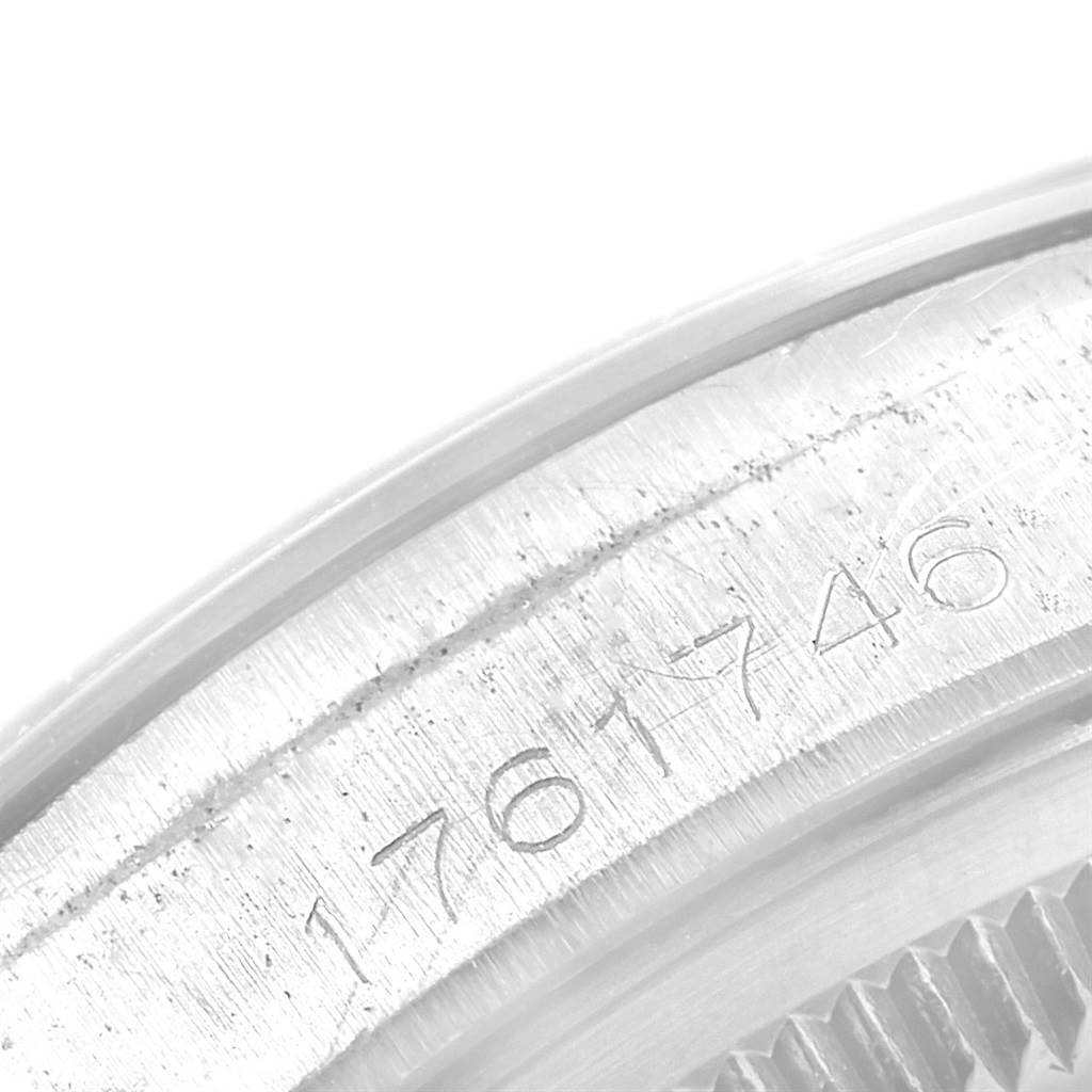 This is a close-up of the outer edge and serial number engraving of the Rolex Vintage Collection 1500 Men's Stainless Steel Silver Dial 1500 Men's Stainless Steel Silver Dial model.