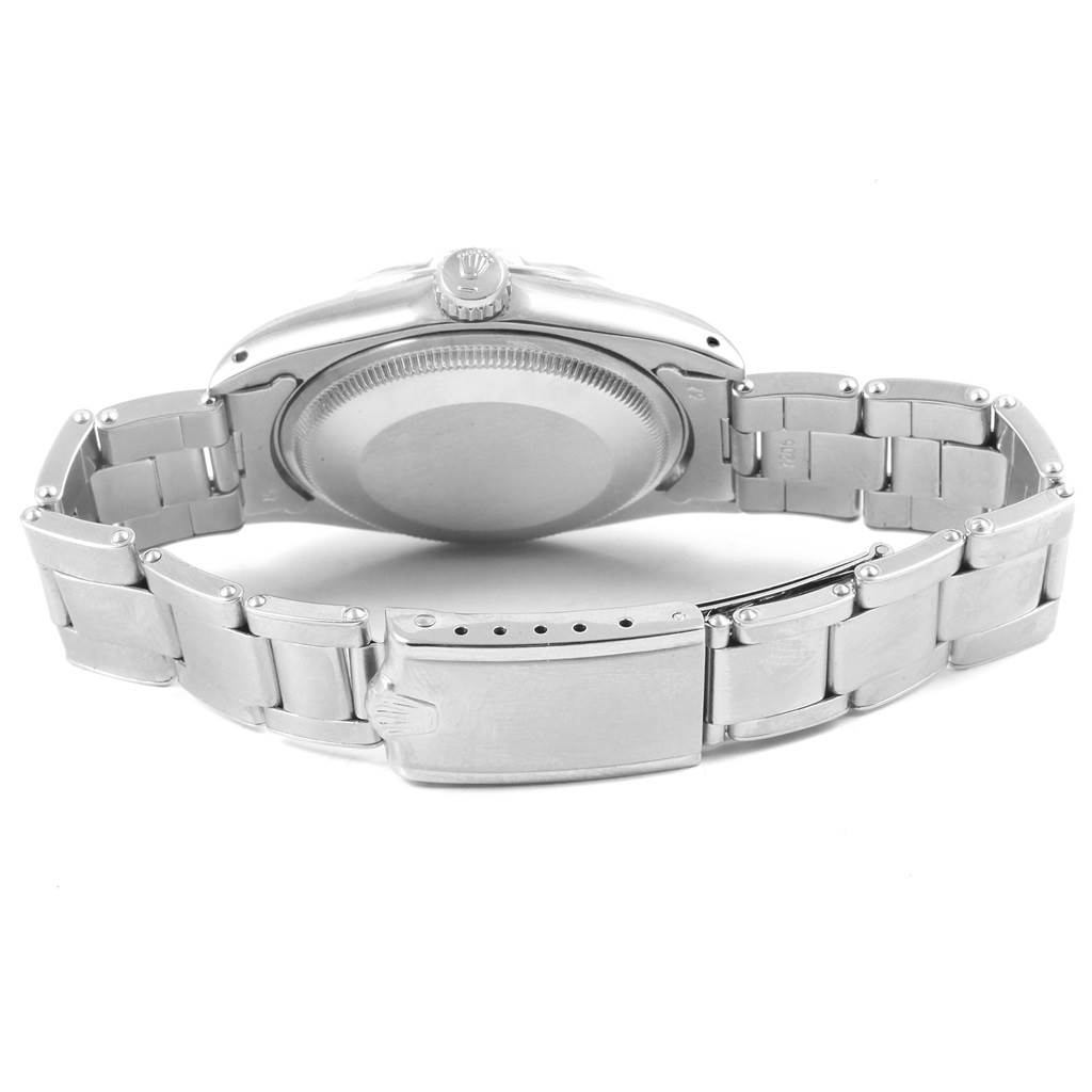 The image shows the back view of a Vintage Collection Rolex watch, highlighting the case back, bracelet, and clasp.