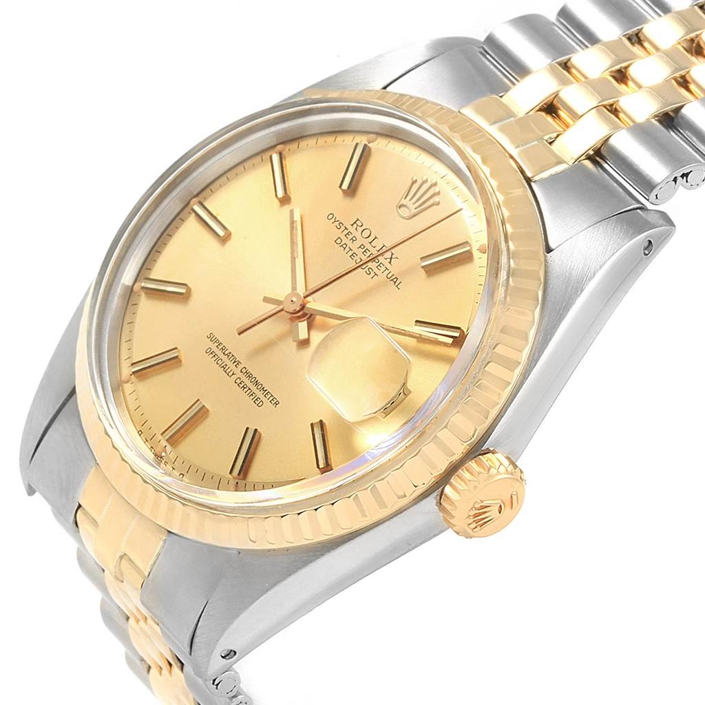 The image shows a side angle of a Rolex Vintage Collection 1601 Men's Steel and Gold (two tone) Champagne Dial 1601 Men's Steel and Gold (two tone) Champagne Dial model, highlighting the gold dial, bezel, and a portion of the bracelet.