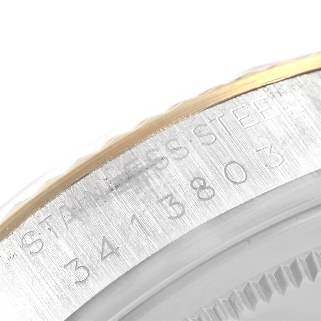 This image shows a close-up of the side of the Rolex Vintage Collection 1601 Men's Steel and Gold (two tone) Champagne Dial 1601 Men's Steel and Gold (two tone) Champagne Dial watch, focusing on the case with the model number engraved.