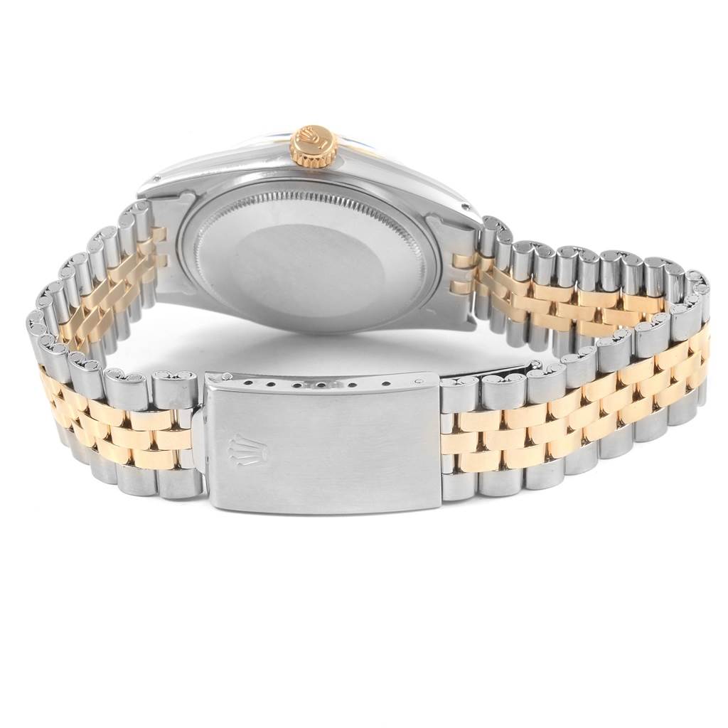 The image shows the back case and bracelet clasp of a Vintage Collection Rolex watch from a rear angle.