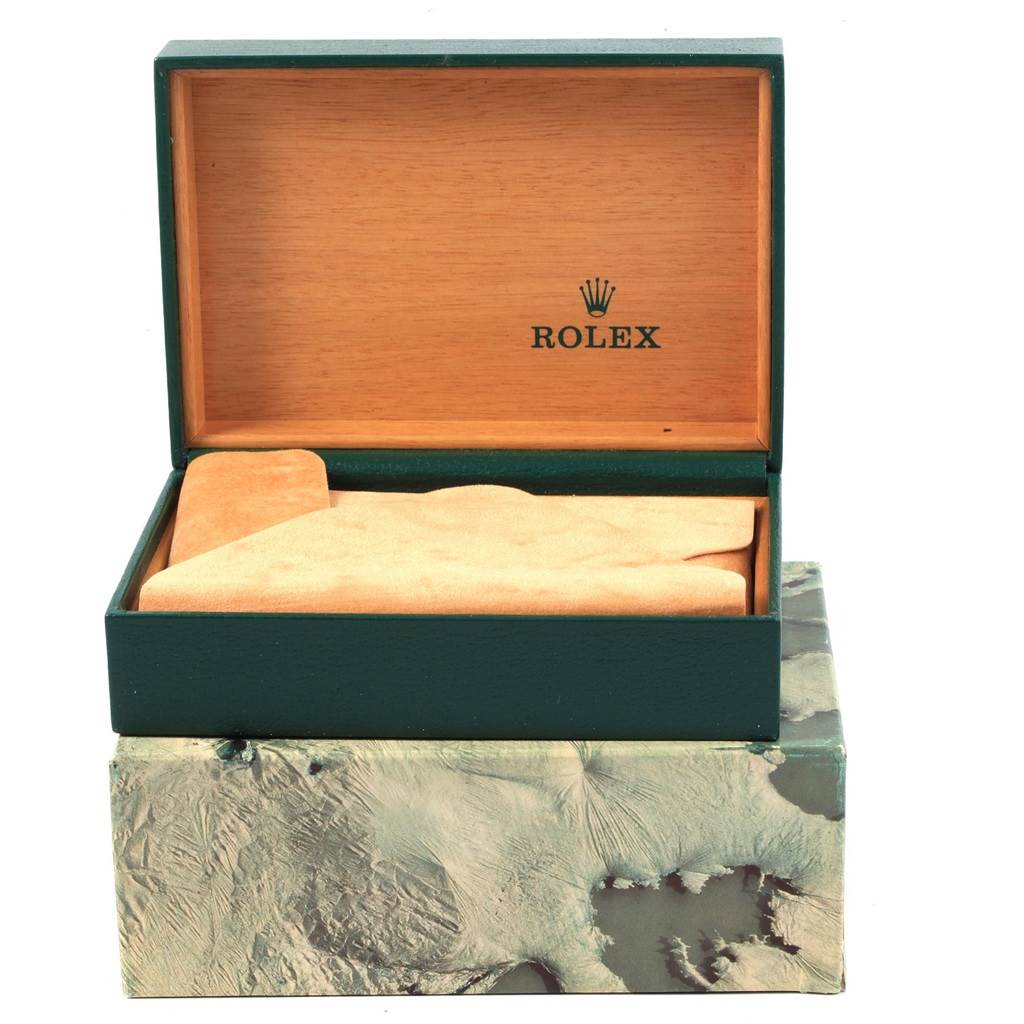 The image shows a green and wood Rolex watch box, part of the Vintage Collection, open at a front angle and displaying the interior.