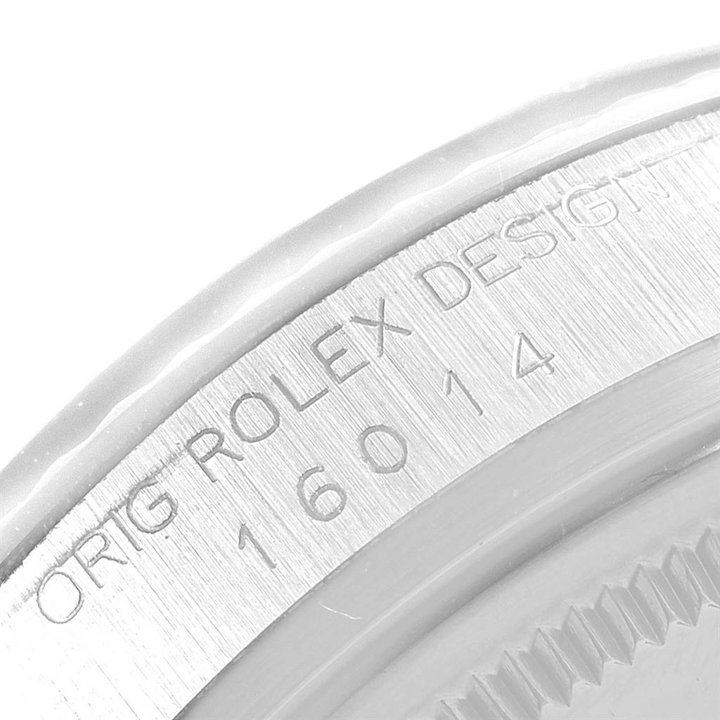 The image shows a close-up of the case back of a Vintage Collection model by Rolex, highlighting the engraved design details.