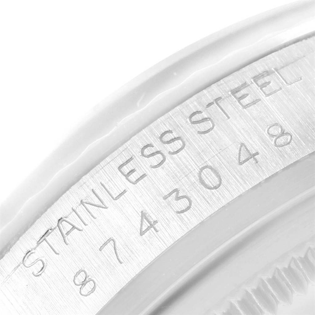 The image shows a close-up angle of the stainless steel case with the serial number engraved for the Vintage Collection model by Rolex.