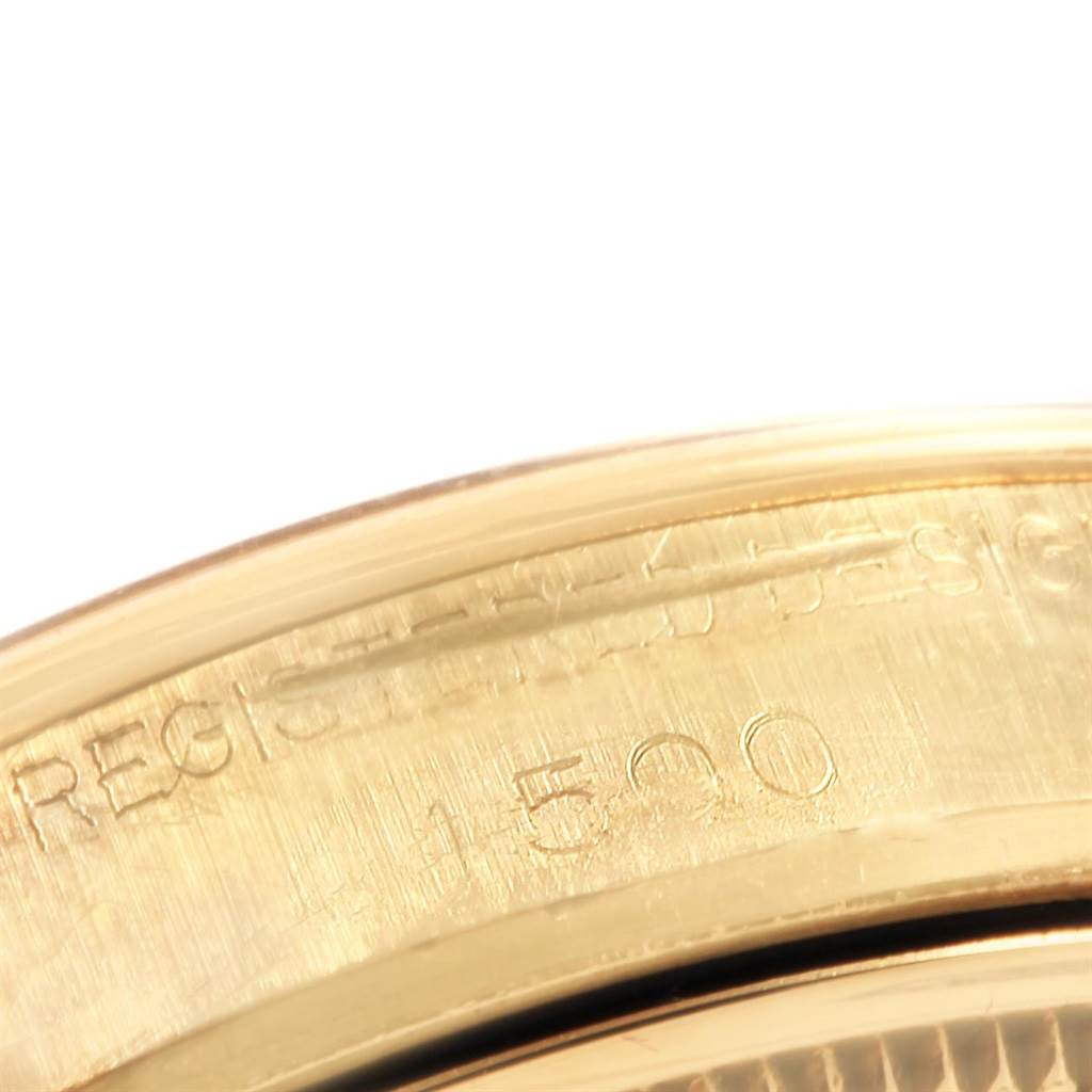 This image shows a close-up view of the case back engraving of a Rolex Vintage Collection 1500 Men
s Yellow Gold Silver Dial 1500 Men
s Yellow Gold Silver Dial watch.