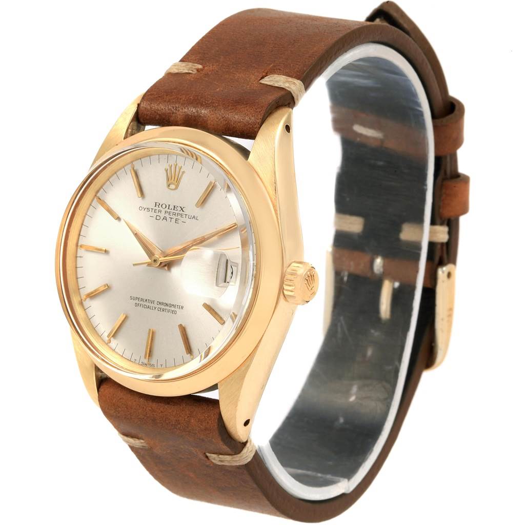 The image shows a Vintage Collection Rolex Oyster Perpetual Date watch, featuring a gold case, silver dial, and brown leather strap, viewed from a front diagonal angle.