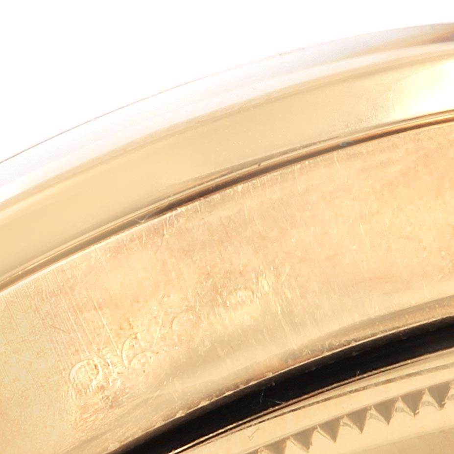 This close-up image shows the side of the case of a Rolex Vintage Collection 1501 Men's Yellow Gold Brown Dial 1501 Men's Yellow Gold Brown Dial watch, highlighting its gold finish.