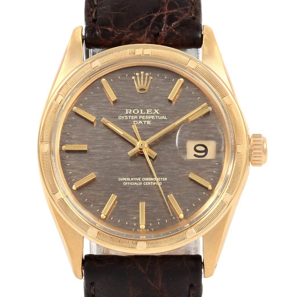 The image shows a front view of a Rolex Oyster Perpetual Date Vintage Collection watch with a brown leather strap and gold casing.